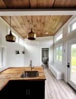 Tiny House mit Schlafzimmer und Dachboden im Erdgeschoss – Bild 9